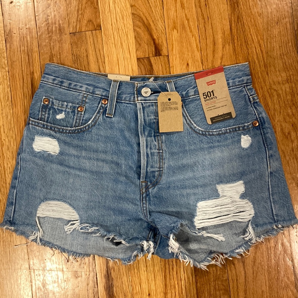 Light blue distressed 501 Levi Shorts. Size 27.